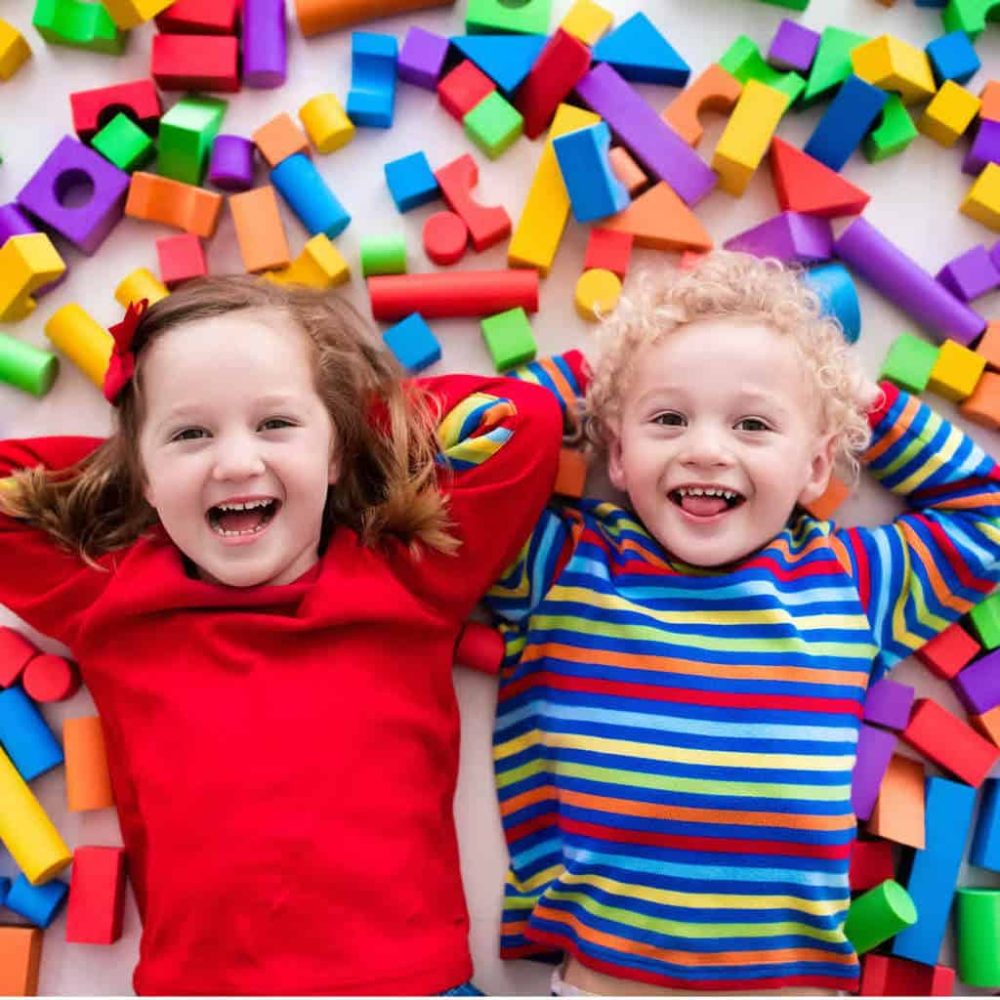 kids play with colorful building blocks