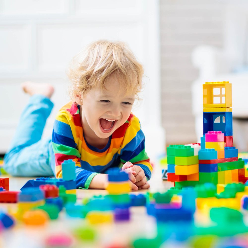 kids engaged in creative block play with blocks